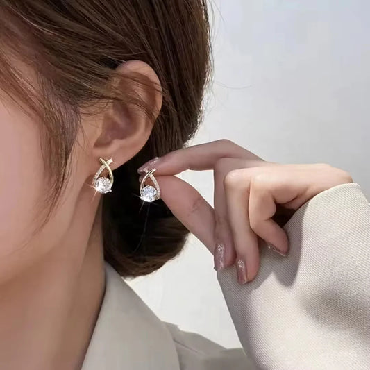 One side white crystal embedded earrings