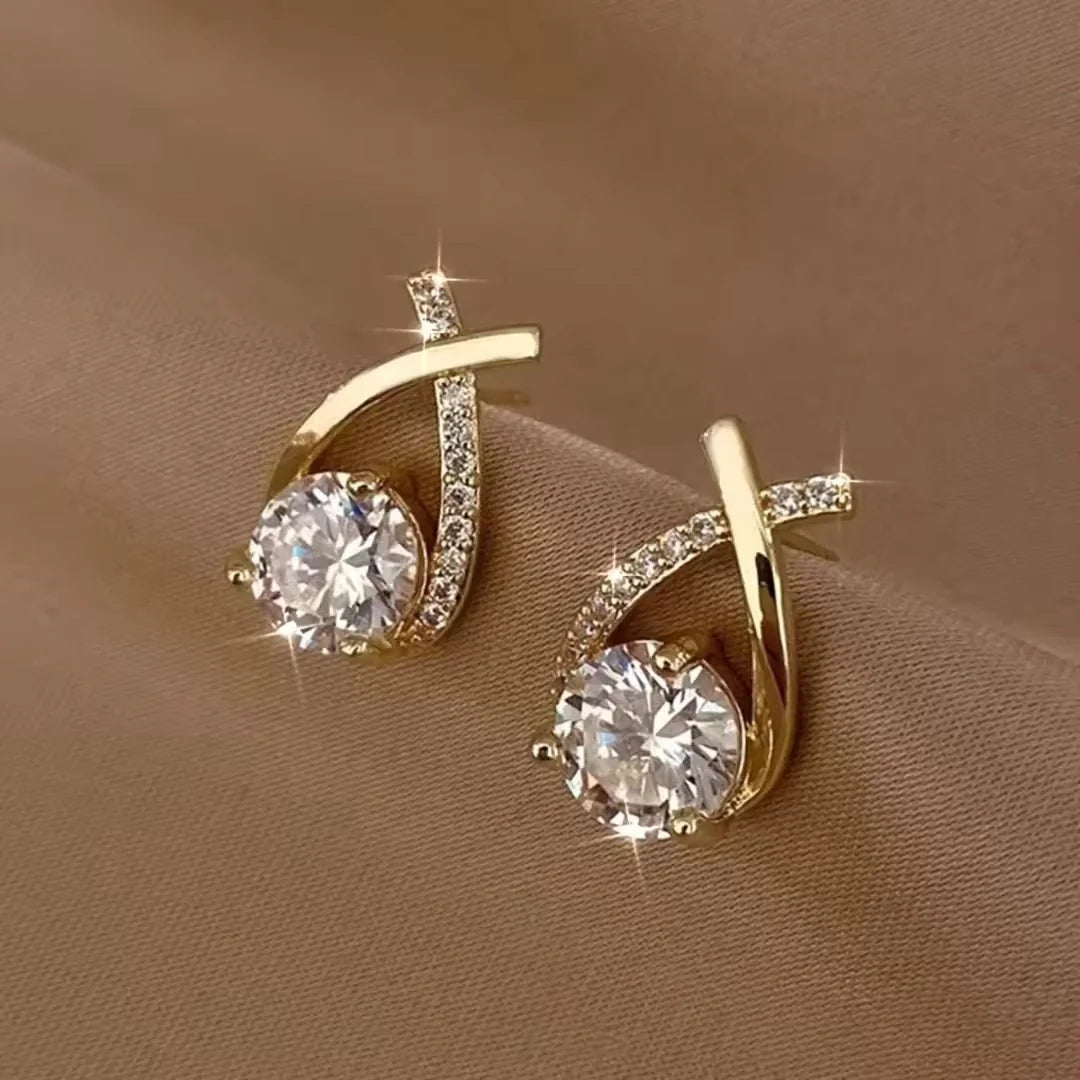 One side white crystal embedded earrings