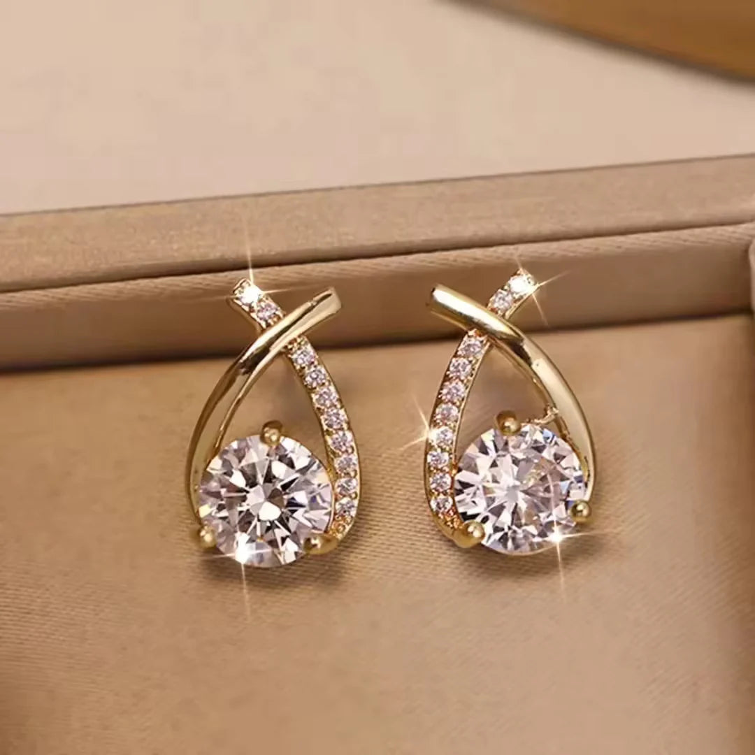 One side white crystal embedded earrings