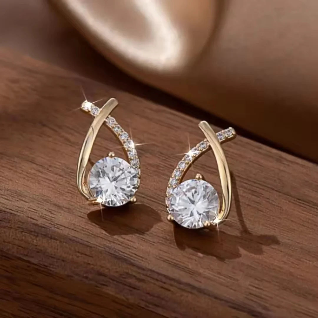 One side white crystal embedded earrings
